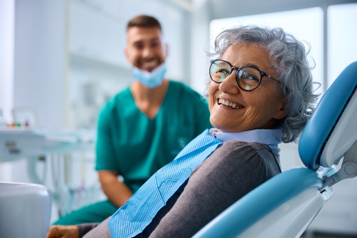 Smiling patient during routine dental checkup, highlighting lifelong oral health in St. Louis, MO.
